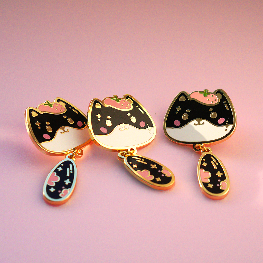 3 Mira cat enamel pins with golden edges