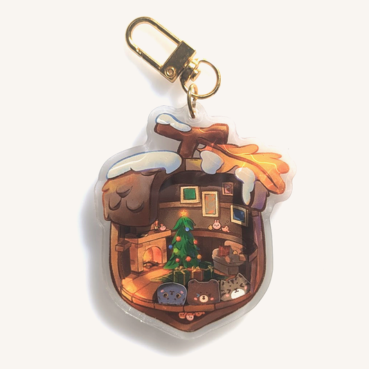 Shaker keychain with golden clamp. Portraying a wooden acorn cottage themed in Christmas decoration. Inside we also find various small bunnies hiding throughout. You can shake the shaker, with our cat Daiki, our cat Momo, and a cute bear.